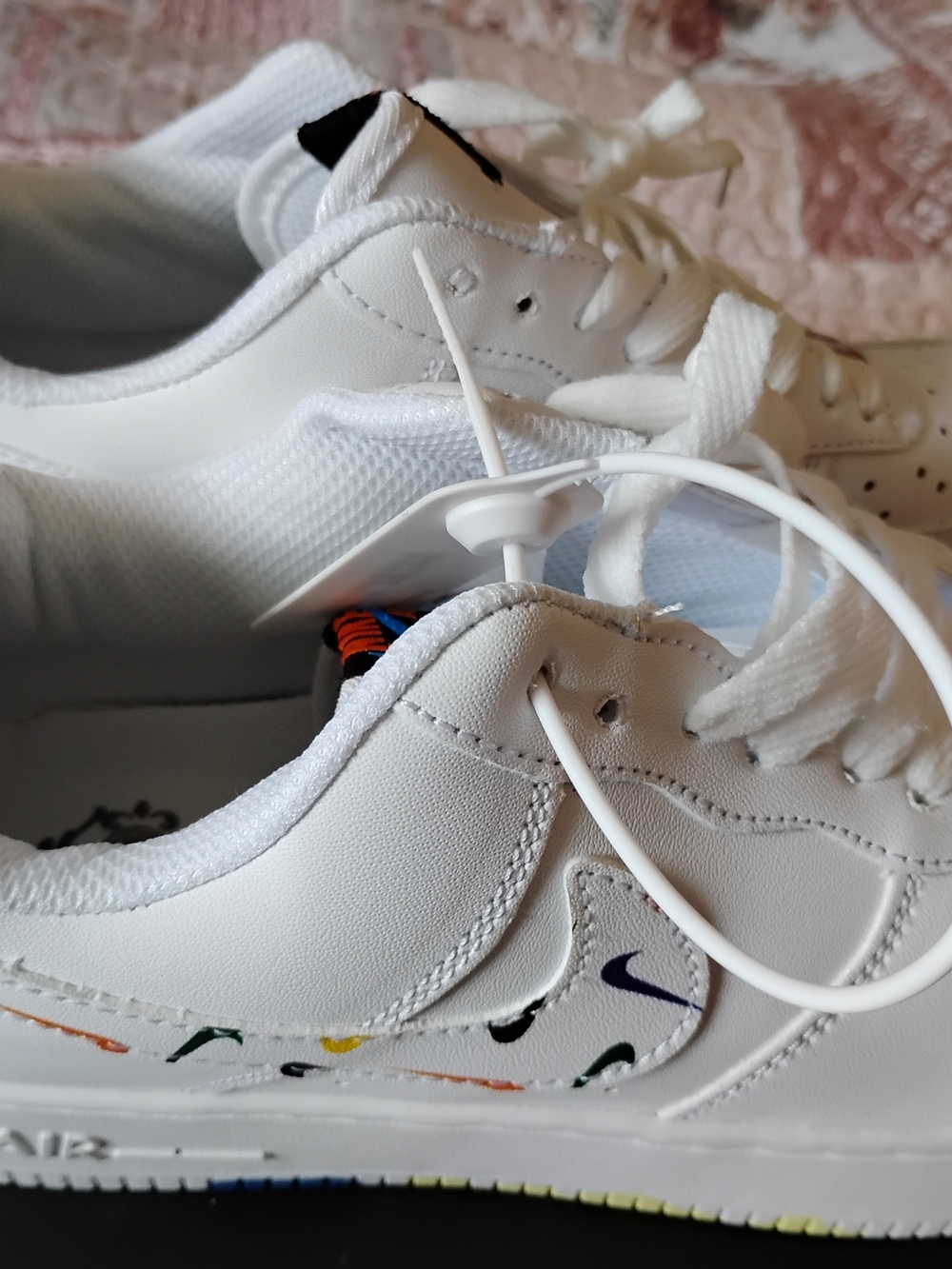 Nike White Low-Top Sneakers with Multicolor Swoosh Accents